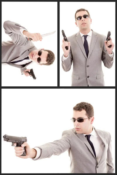 Retrato de hombre joven con pistola y un traje — Foto de Stock