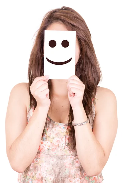 Hübsche junge Frau mit Smiley-Emoticon — Stockfoto