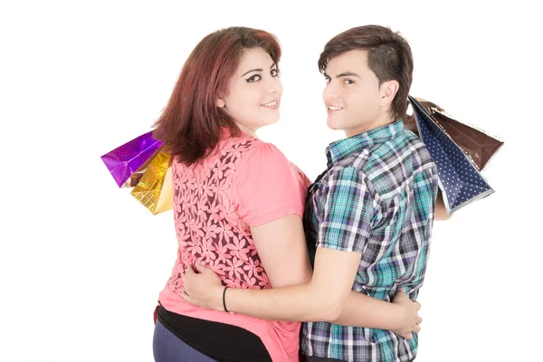 Couple with shopping bags in variety of colors. — Stock Photo, Image