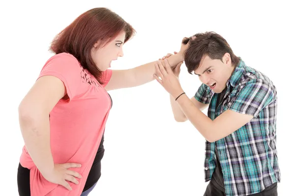 Closeup of a young casual couple pulling hair — Stock Photo, Image