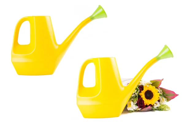 Yellow watering can set and sunflowers — Stock Photo, Image