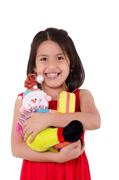 Unschuldiges kleines Mädchen spielt mit einer Puppe — Stockfoto