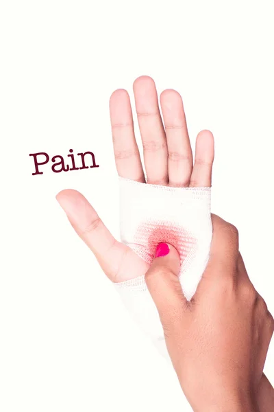 Bu ağrı işareti üzerinde kanlı gazlı bez ile bir adamın elini — Stok fotoğraf