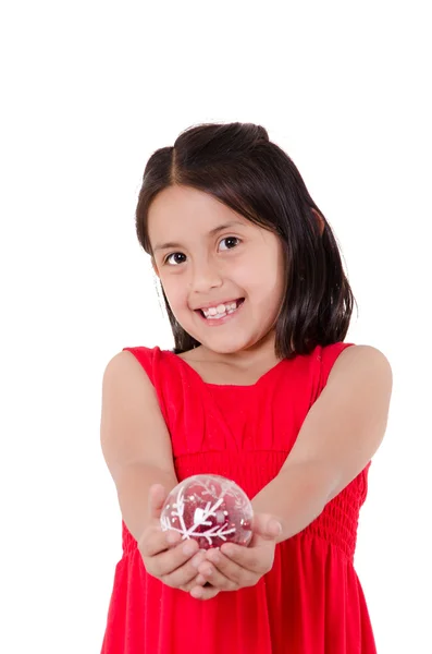 Child Hand holding a christmass ornament — Stock Photo, Image