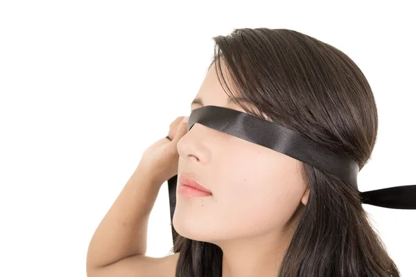 Hispanic woman covering her eyes with a blindfold — Stock Photo, Image