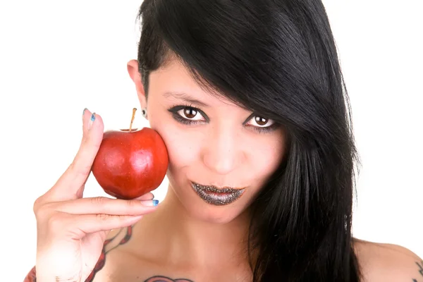 Portrait of caucasian young woman with apple and tattoos — Stock Photo, Image