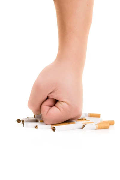 Man's fist crushing cigarettes isolated on white background — Stock Photo, Image