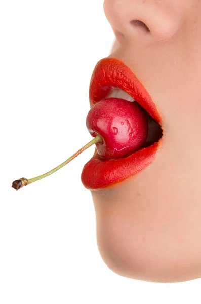 Young woman's mouth with red cherries  over white background — Stock Photo, Image