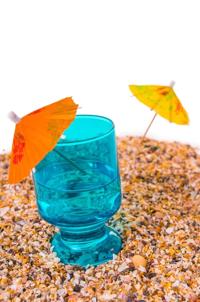 Cocktail Umbrella in Sand Mound with Shells — Stock Photo, Image