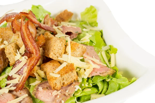 Detail of salad with lettuce and bacon — Stock Photo, Image