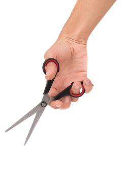 Scissors in hand on white background clipart