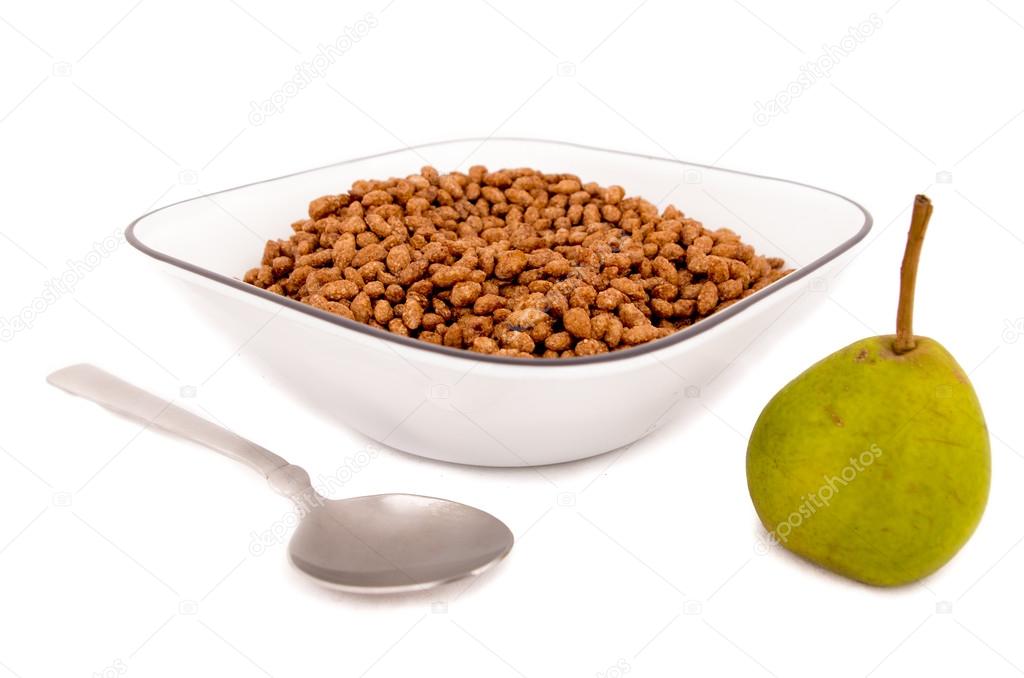 Chocolate cereal breakfast on a bowl with a pear