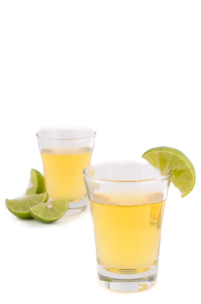 Gold tequila shot with lemon — Stock Photo, Image