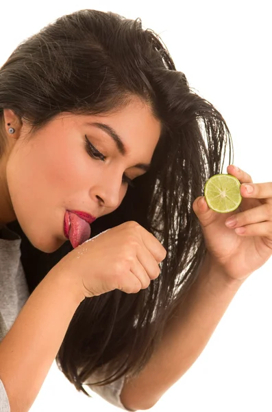Hispanic woman taking a tequila shot — Stock Photo, Image