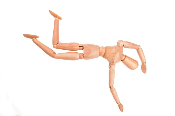 Wooden figure mannequin falling down isolated on white — Stock Photo, Image
