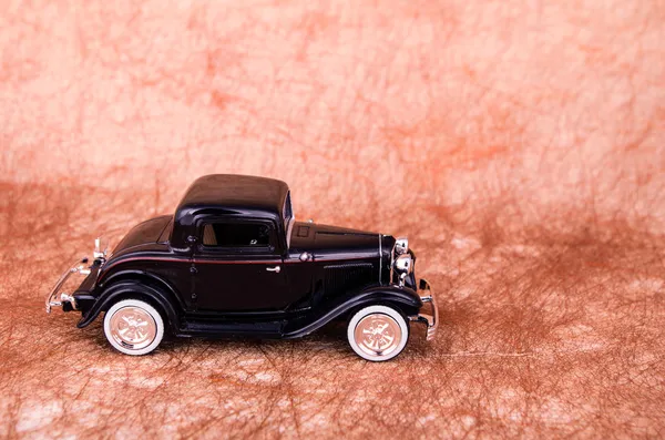 Vintage toy cars in an old background — Stock Photo, Image