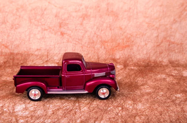 Vintage toy cars in an old background — Stock Photo, Image