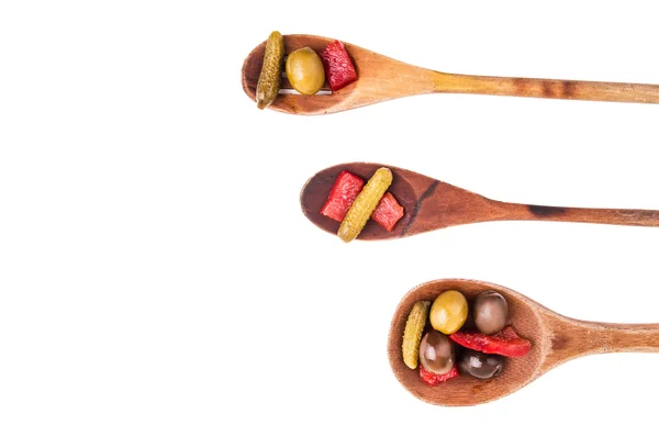 Wood spoons and vegetables on white background — Stock Photo, Image