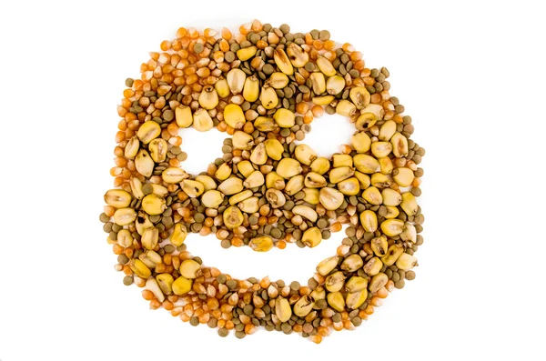 Happy face with grains on a white background — Stock Photo, Image