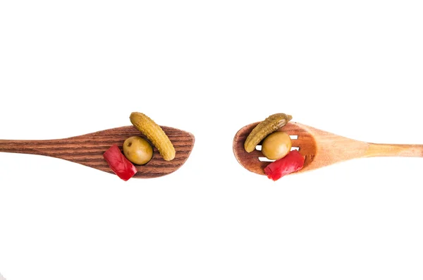 Wood spoons and assorted peppers on white — Stock Photo, Image