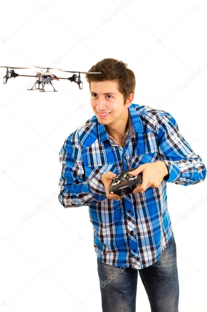 Man playing with a quadcopter drone