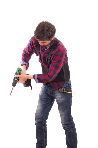 Hombre con taladro eléctrico sobre fondo blanco, manitas —  Fotos de Stock