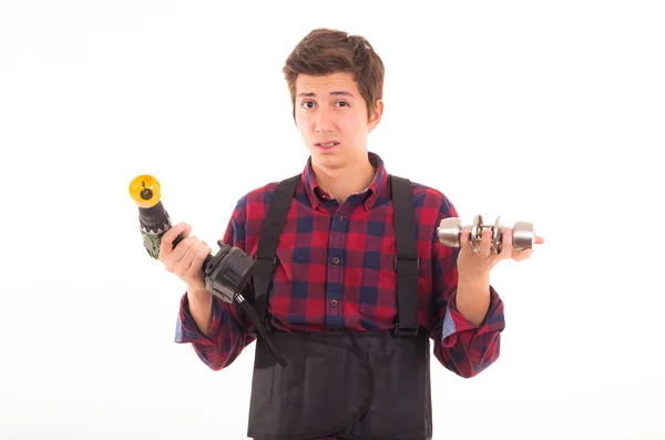 Man with drill and door knob on a white background — Stock Photo, Image