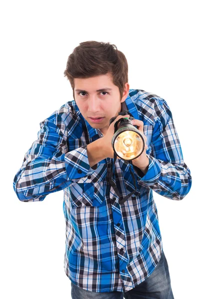 Hombre buscando con linterna sobre un fondo blanco —  Fotos de Stock