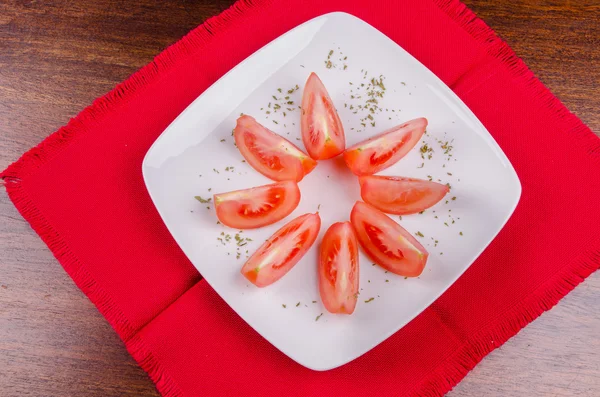 Tomato ready to serve on a plate — Stock Photo, Image