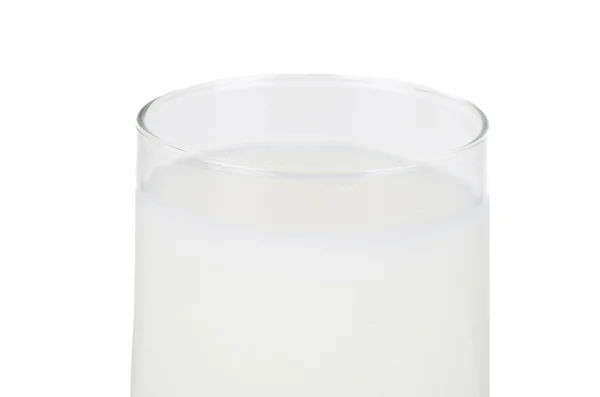 Vaso de leche sobre un fondo blanco —  Fotos de Stock