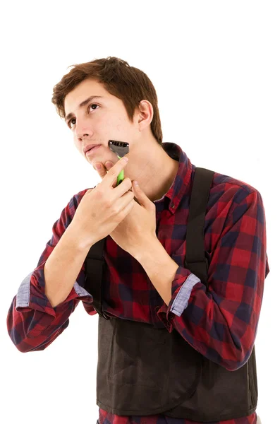 Hombre afeitándose sobre un fondo blanco —  Fotos de Stock