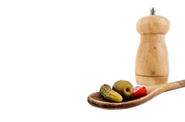 Wood spoon and vegetables with salt shaker — Stock Photo, Image