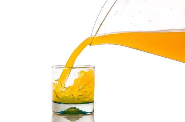 Pouring orange juice splash on a white background — Stock Photo, Image