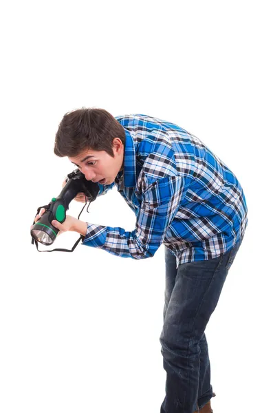 Muž hledání s baterkou na bílém pozadí — Stock fotografie