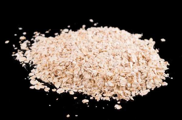 Oatmeal in a dark background — Stock Photo, Image