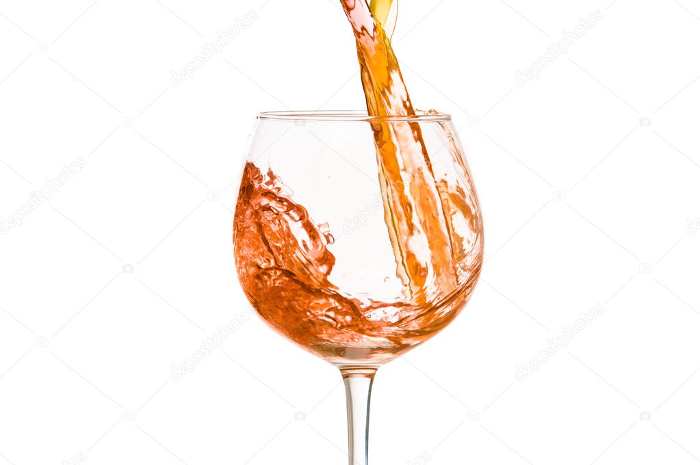 Wine and a glass pouring on a white background