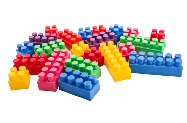 Building blocks scattered on a white background — Stock Photo, Image