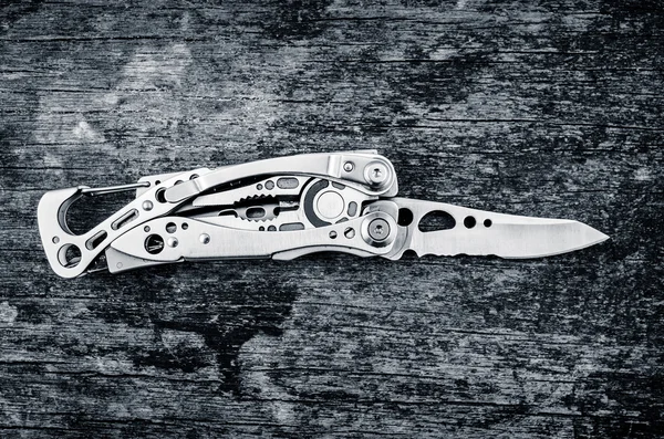 Multitool, multi purpose tool with plyers and knife color toned — Stock Photo, Image