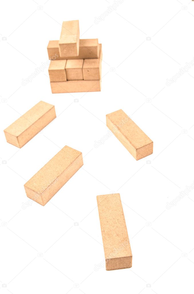 Jenga tower colapsing on a white background