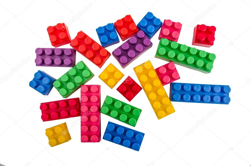 Building blocks scattered on a white background