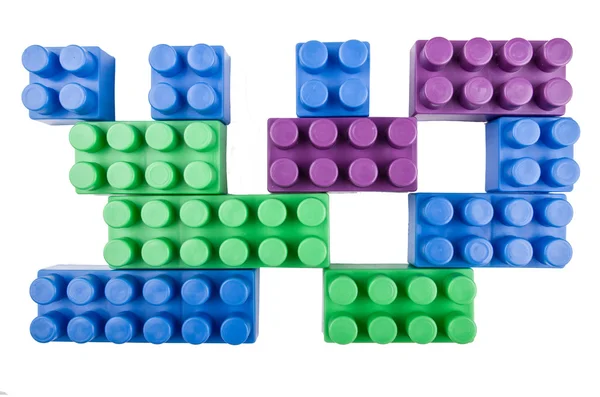 Building blocks  pieces joining on a white background — Stock Photo, Image