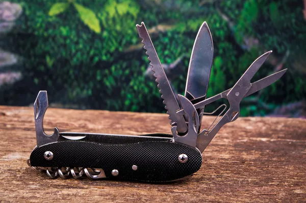 Black swiss army knife multitool — Stock Photo, Image