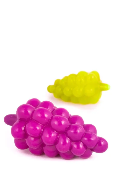 Alimentos coloridos de plástico sobre fundo branco — Fotografia de Stock