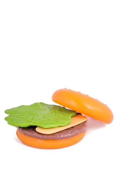 Plastic toy hamburger with bun — Stock Photo, Image