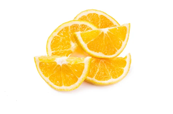 Scattered slices of orange on a white background — Stock Photo, Image