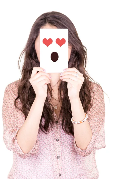 Vrouw met emoticon op een papier in haar gezicht — Stockfoto
