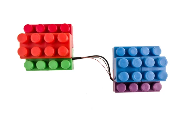 Lego bricks connected with wires — Stock Photo, Image