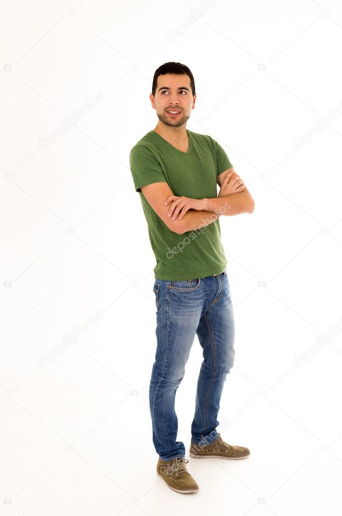 young man jeans green t-shirt standing crossing arms