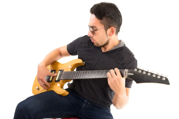 Hispanic young man playing electric guitar — Stock Photo, Image