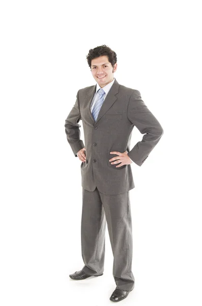 Ung man i en kostym poserar — Stockfoto